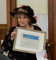 Gail Chism of the Lowell Civic Association accept the award for the Publication 150 Years of Lowell History which she wrote with co-author Karen Redfield.